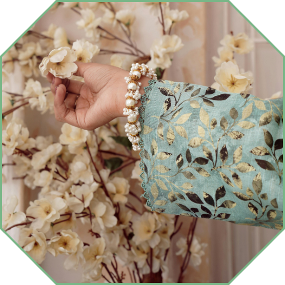 A hand reaching out to a flower